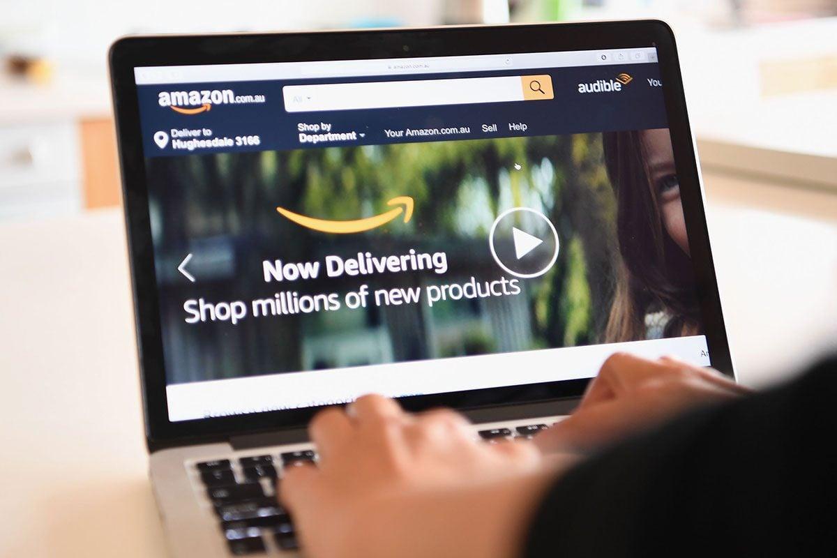 The Amazon Website is seen on a computer screen and out of focus background